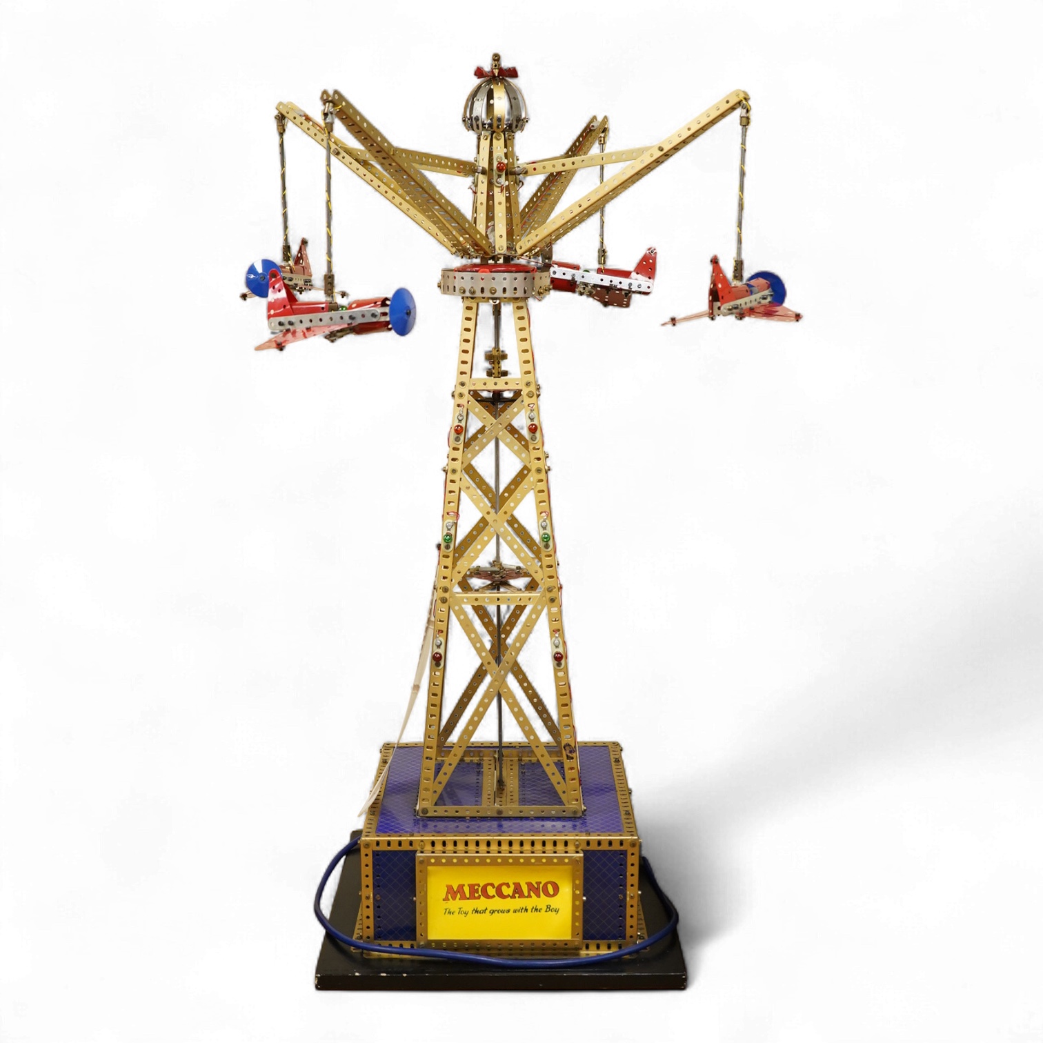 A Meccano model of a fairground ride, incorporating an electric motor in the base and lighting throughout, built in the style of a shop display centrepiece, approx 106cm high, 85cm diameter